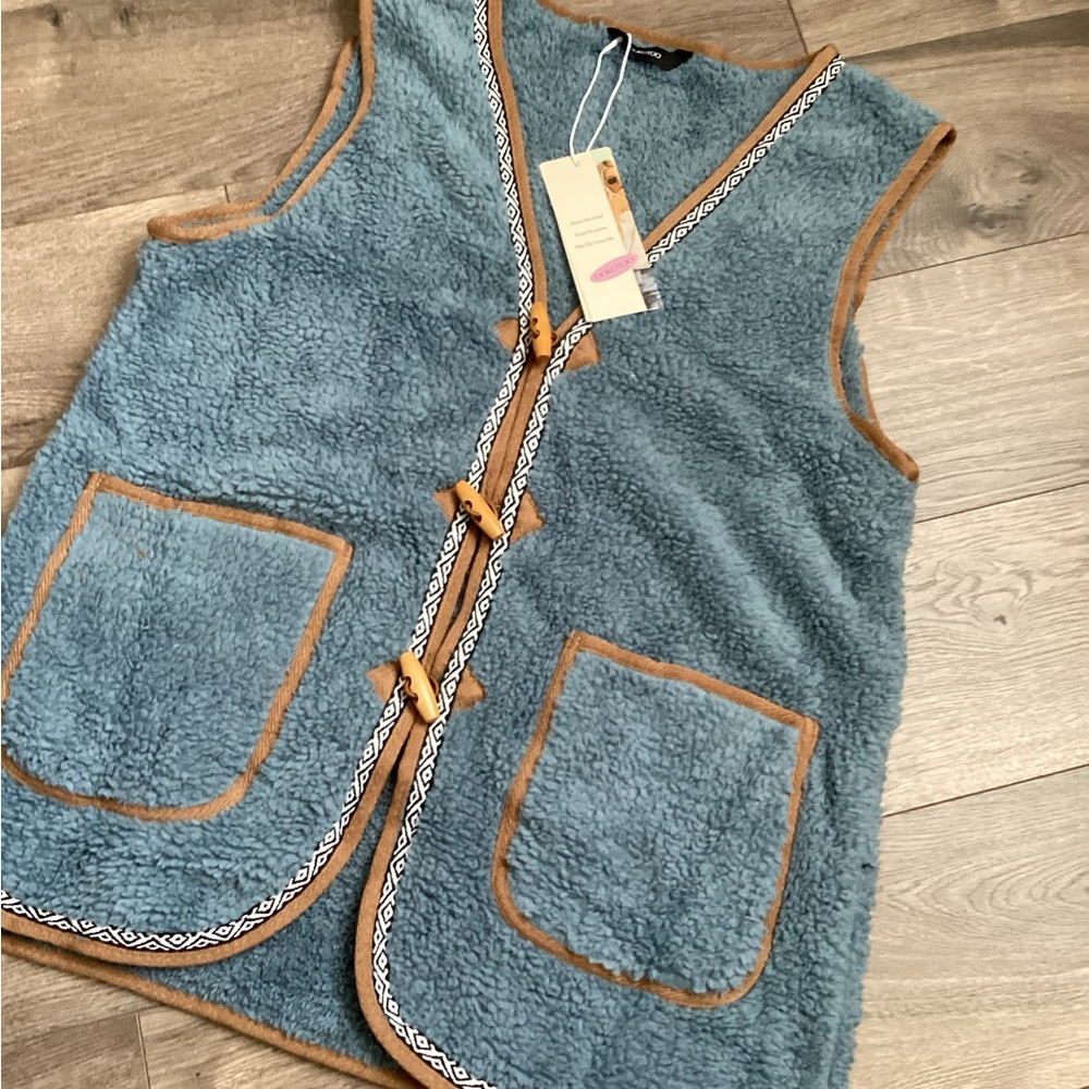 Cozy Dokotoo Blue Fleece Vest with Brown Trim women’s size small.